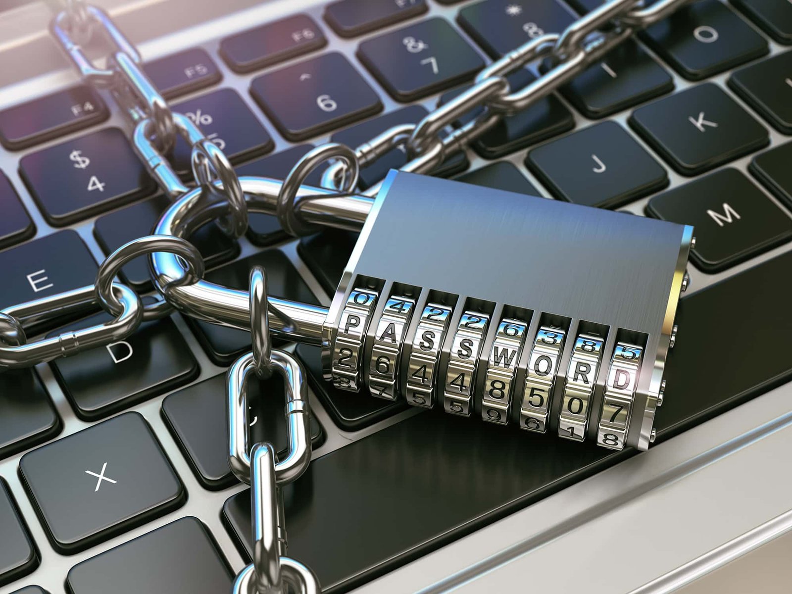 Close-up of a keyboard secured with a chain and combination padlock displaying the word password, symbolizing cybersecurity